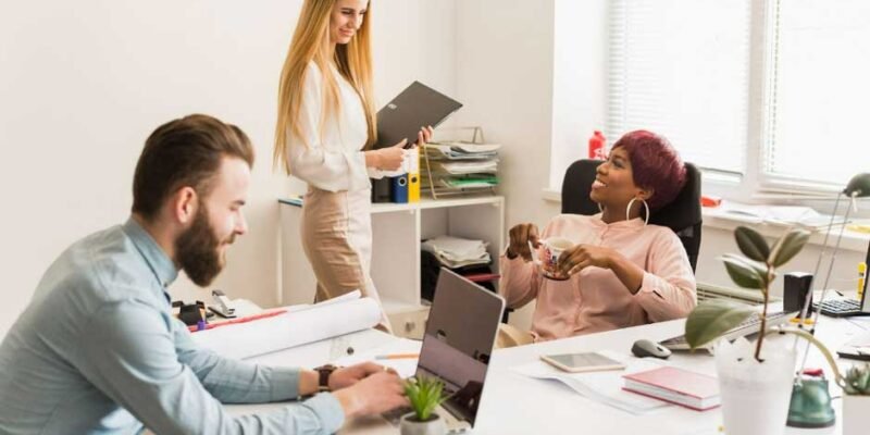 three colleagues collaborating in a modern office